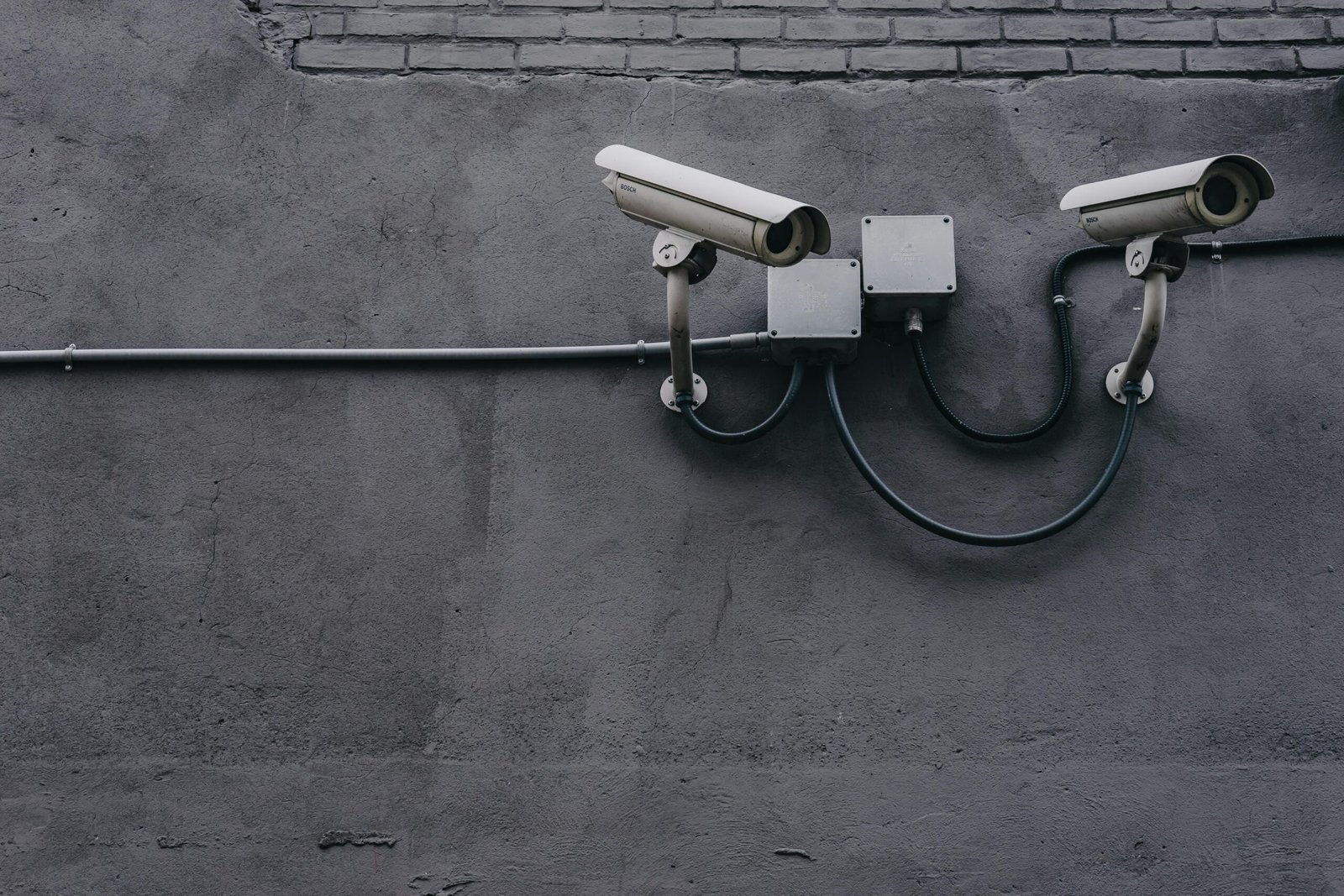 2 CCTV cameras mounted on a wall